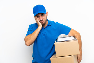 Delivery man over isolated white background unhappy and frustrated