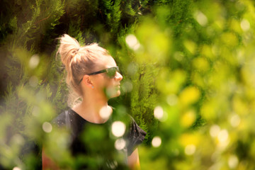 girl blurred nature green background