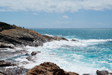 Fototapeta na wymiar Beautiful azure sea and the rocky beach