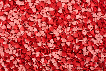 Full frame background of heart shaped sprinkles. Valentines Day background.