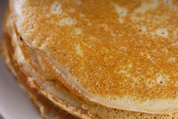Breakfast with pancakes on a textured background