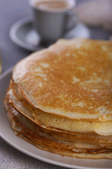 Breakfast with pancakes on a textured background