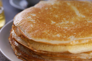 Breakfast with pancakes on a textured background