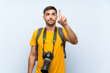 Young photographer man touching on transparent screen