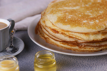 Breakfast with pancakes on a textured background