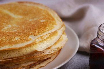 Breakfast with pancakes on a textured background