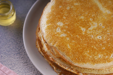 Breakfast with pancakes on a textured background