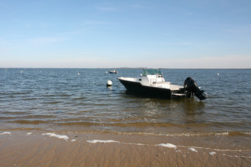 modern boat in Bassin Arcachon in Cap-Ferret village view of Atlantic ocean sea