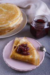 Breakfast with pancakes on a textured background