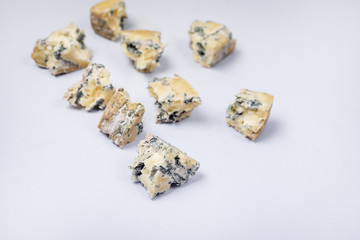 Blue cheese Gorgonzola Gorgonzola Cheese Slices on Blue Background Tasty Italian Cheese Horizontal Copy Space