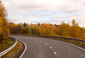 Fototapeta premium M8 highway, a picturesque road with a typical landscape of Central Russia: fields, forests and villages. Autumn