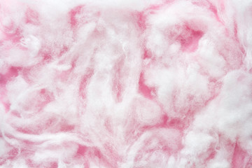 Siliconized hollowfiber, polyester fiber on a pink background, used as a filler for blankets, pillows, clothes and upholstered furniture