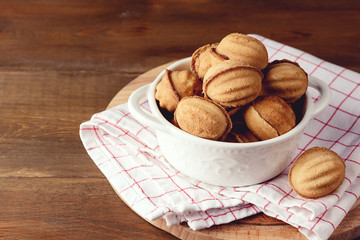White Bowl of Tasty Homemade Nuts Cookies on Wooden Tray Wooden Background Holiday Tasty Homemade Dessert