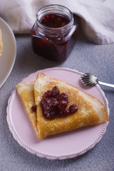 Breakfast with pancakes on a textured background
