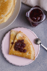 Breakfast with pancakes on a textured background