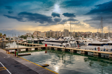Fototapeta na wymiar Luxury motorboats and yachts at the dock. Marina Zeas, Piraeus,Greece.