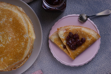 Breakfast with pancakes on a textured background