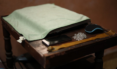 laptop computer with mouse and mobile phone on work table front view