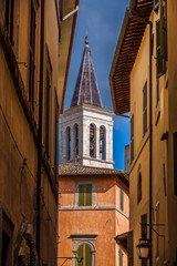 View of Spoleto medieval historic center with cathedral bell tower