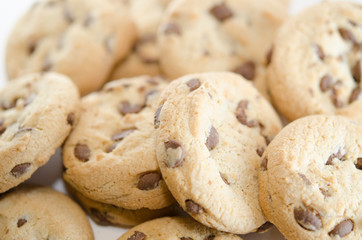 Lots of chocolate chip cookies. Close-up on baking. Delicious homemade dessert.
