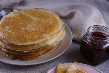 Breakfast with pancakes on a textured background