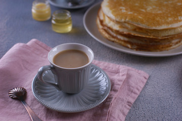 Breakfast with pancakes on a textured background