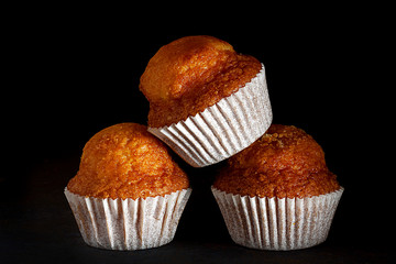HOMEMADE MUFFIN ON BLACK BACKGROUND