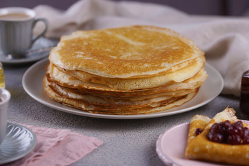 Breakfast with pancakes on a textured background