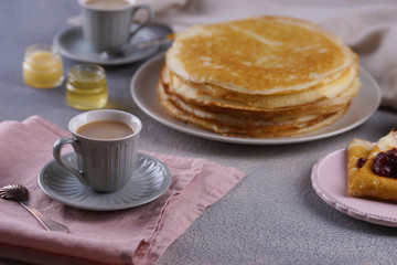Breakfast with pancakes on a textured background