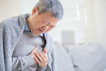 asian elderly man feel chest pain