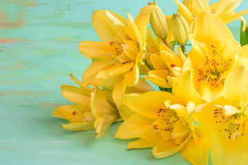 Close up of Lily flowers on the wooden background.