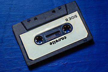 Old audio cassette with magnetic tape.