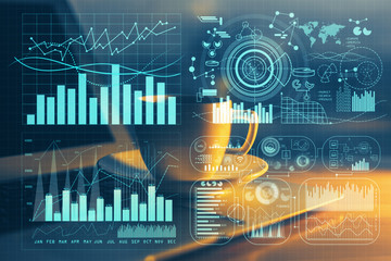 Double exposure of forex chart and work space with computer. Concept of international online trading.