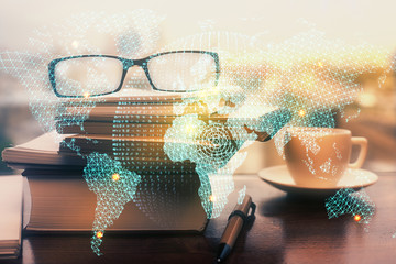 Business theme hologram with glasses on the table background. Concept of search. Double exposure.