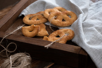 Sugar pretzels on a wooden tray.