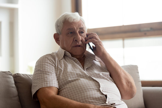 Elderly man talk on phone having distant communication with doctor