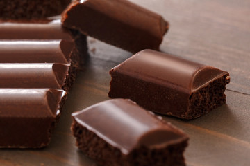 Sweet life. Porous chocolate isolated on table close-up