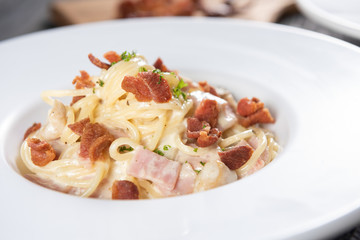 Spaghetti carbonara with bacon or Pasta white cream sauce with grilled bacon
