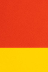 Yelllow red color paper background. Geometric figures, shapes. Abstract geometric flat composition. Empty space on monochrome cardboard