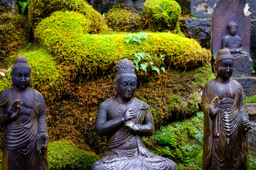 Japanese gods statue in mitakidera temple garden, Hiroshima