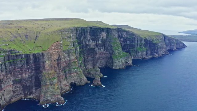 Panoramic aerial view from Sandoy island cliffs under the clouds, Faroe Islands