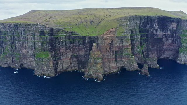 Panoramic aerial view from Sandoy island cliffs under the clouds, Faroe Islands