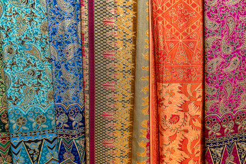 Assortment of colorful sarongs for sale in local market, Island Bali, Ubud, Indonesia. Closeup
