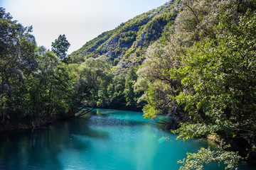 Beautiful and turquoise river Una in canyon on the Croatian and Bosnia and Herzegovina border. Forest and mountains next to the river.