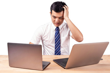 Stressed Asian business people with 2 laptops