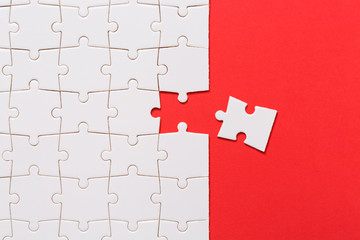 Business teamwork concept, Missing puzzle piece on red background. Search for the solution, solve the problem.... - obrazy, fototapety, plakaty