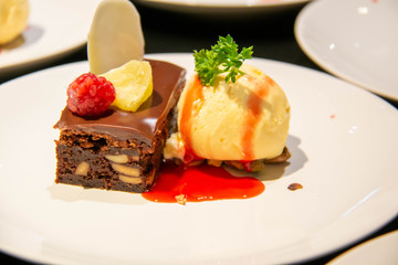 A cake and ice cream dessert on plate