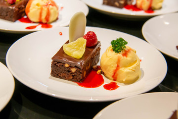 A cake and ice cream dessert on plate
