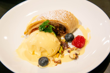 A cake and ice cream dessert on plate