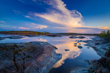 Karelia. Trip to Russia. Sunset over lake Ladoga. Rocky Islands of lake Ladoga. nature of Karelia. Rocky shore. Northern nature. Rest away from the city.